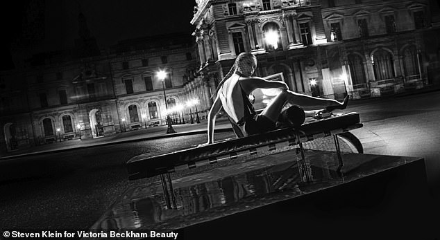 Gorgeous: Victoria wore a black silk mini dress before posing in the streets of the City of Light