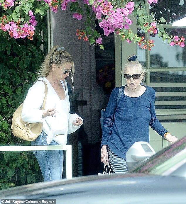 Michelle enjoyed lunch with a friend and sipped a glass of wine