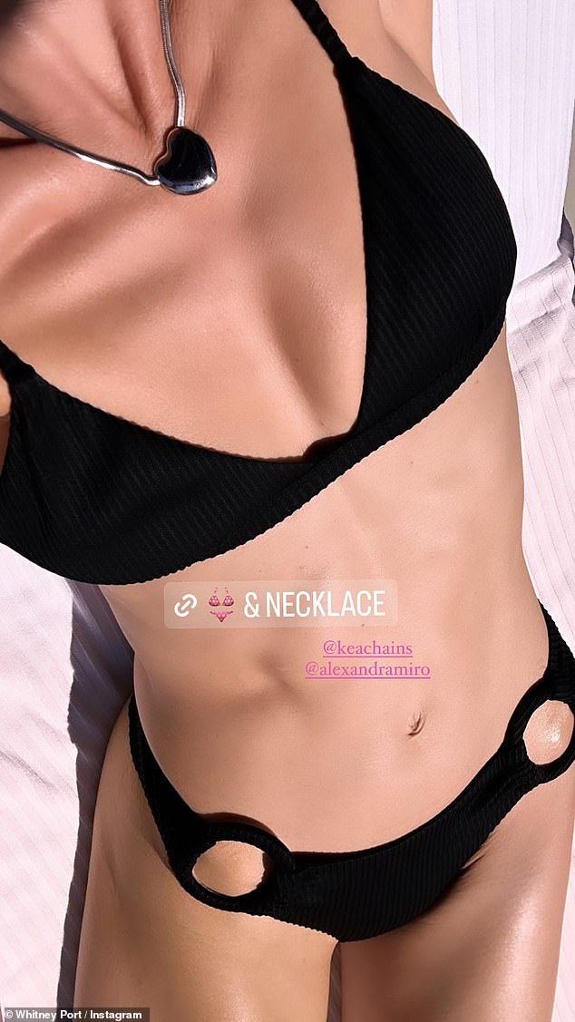 Showing off her body: She was headless in this photo where she showed off her suit and necklace at a resort