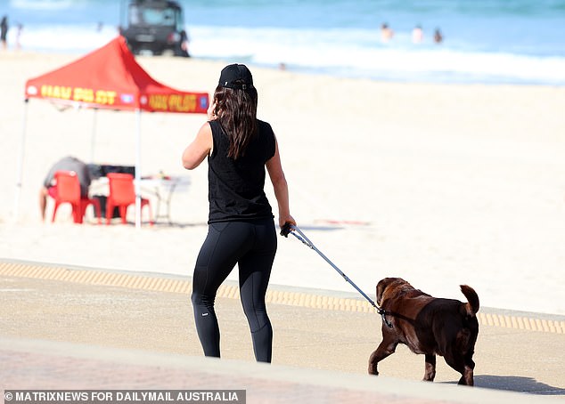 Hours later, Mason emerged to take out the rubbish before walking her dog to nearby Maroubra beach