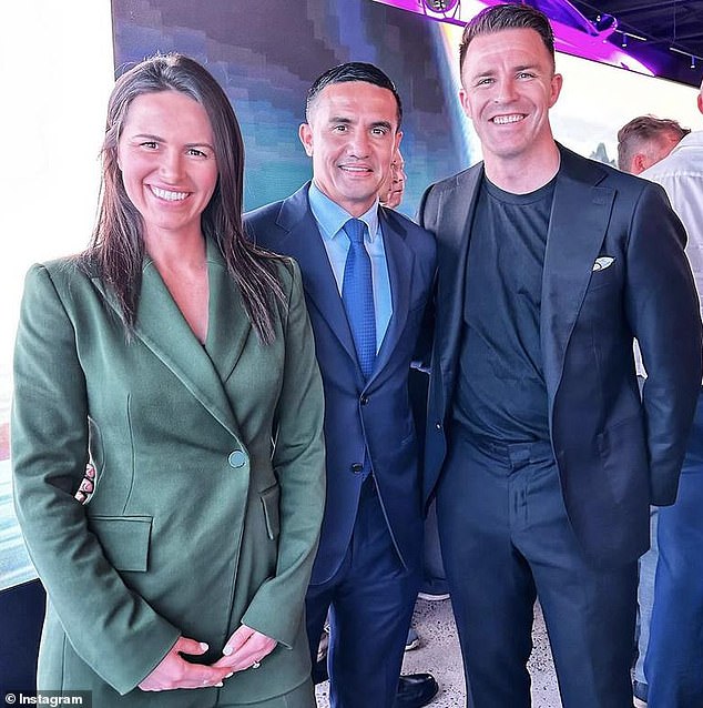 The couple are pictured with football legend Tim Cahill (centre) at an event to launch the new BYD electric car showroom in Alexandria, Sydney's south, two weeks ago.