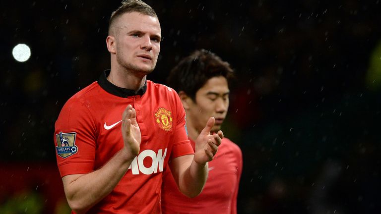 Manchester United's Tom Cleverley and Shinji Kagawa leave the pitch after their team's 2-1 defeat to Swansea City