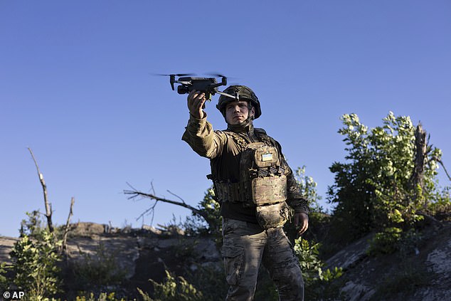 To bolster its arsenal, and in light of Russia's superior long-range missiles, Ukraine has begun making do-it-yourself drones that have proven to be one of the deadliest and most widespread weapons since Putin's invasion.  In the photo: a Ukrainian soldier, known as "Bra" by "Coding 9.2" launches a drone before flying over Russian frontline positions in the Donetsk region