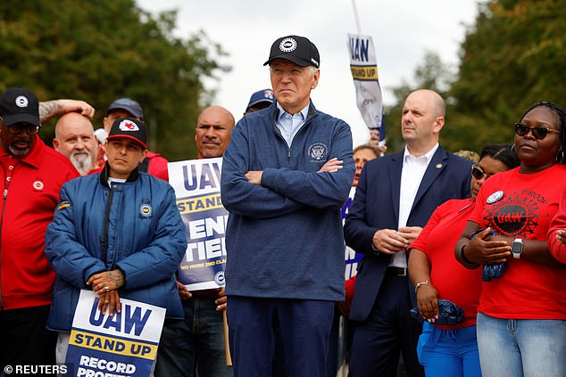 President Biden listens as Shawn Fain, president of United Auto Worker, addresses the striking workers