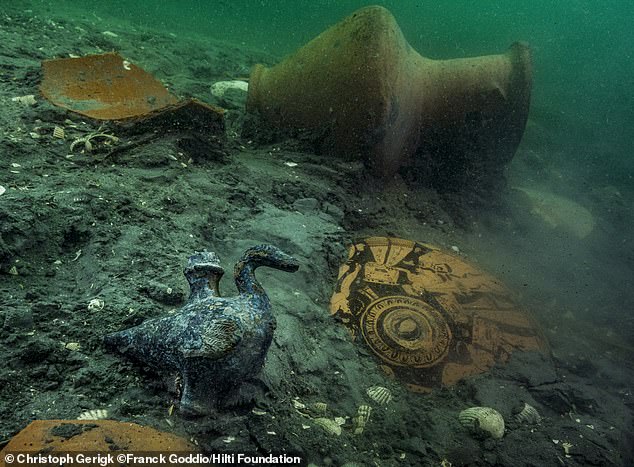 A delicate bronze duck-shaped cupbearer is discovered among 4th-century BC ceramics at the site of a newly discovered Greek sanctuary to Aphrodite at Thonis Heracleion.