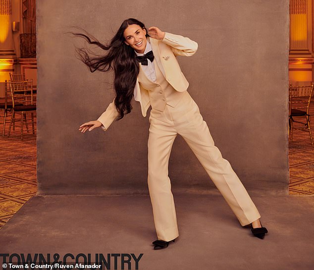 Capote-esque: During the photo shoot, Demi was styled in a very Capote-esque cream suit with a fitted jacket, vest and high-waisted trousers