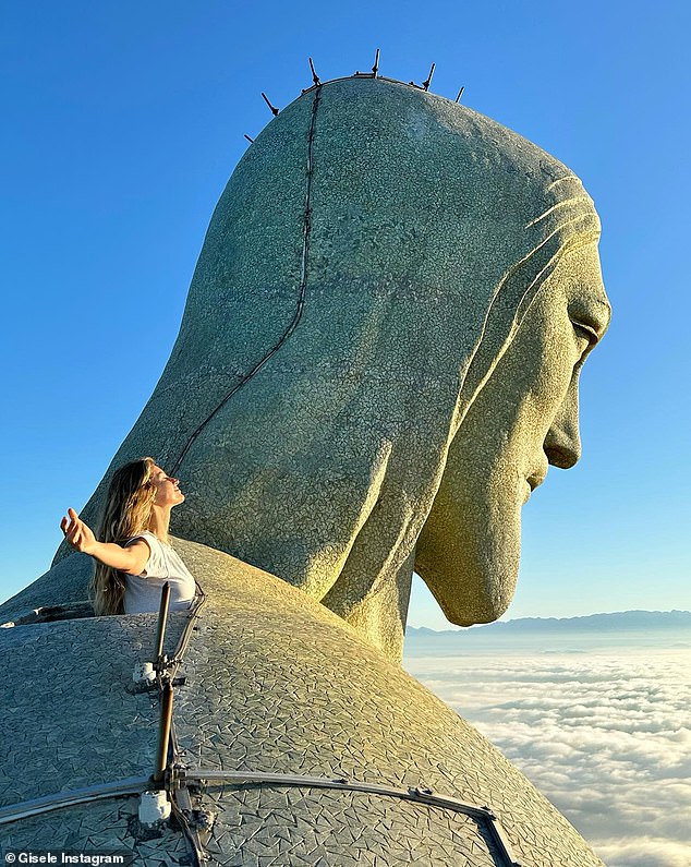 Queen of the world: Gisele posed in front of the famous statue of Christ the Redeemer in Rio de Janeiro