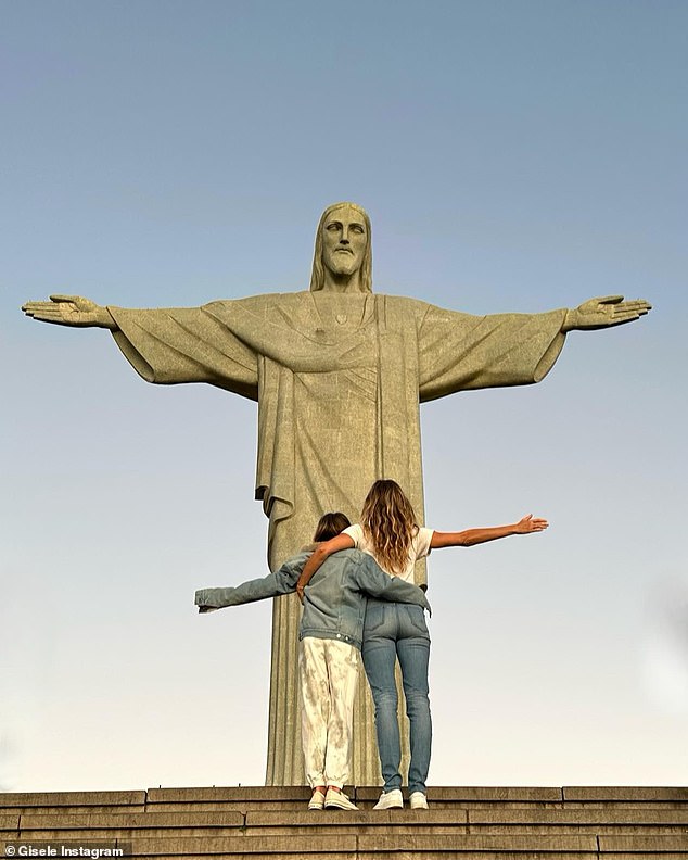 Taking it all in: Gisele and a family member posed in front of the famous Art Deco piece