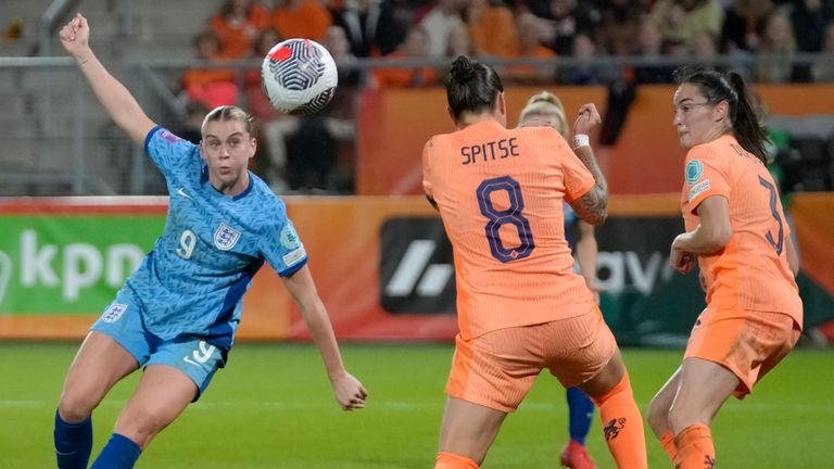 England's Alessia Russo, left, scores her team's first goal against the Netherlands 