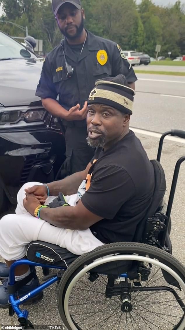 Part two of the video shows the officer handcuffing the man as he sits in his wheelchair on the side of the road, sparking further outrage from viewers.