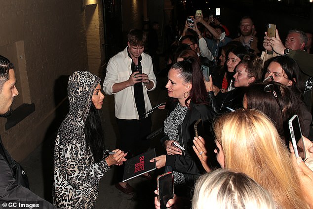 Star: Nicole appeared cheerful as she stopped to talk to fans and sign autographs