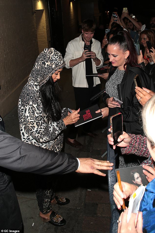 In demand: Fans seemingly couldn't wait to get Nicole's autograph