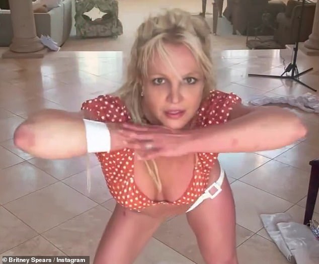 The Oops!... I Did It Again singer danced to the 1990 Enigma song Sadeness (Part I) while wearing a white bandage on her wrist while there appeared to be a cut on the front of her right leg