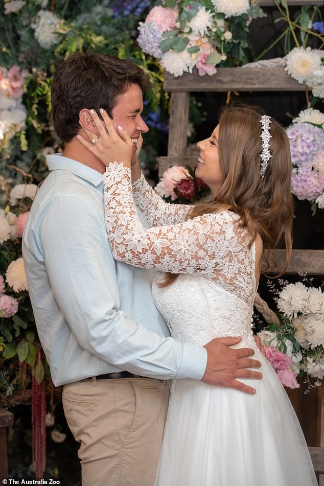 She told Fox News Digital this week: 'My life looks very different now than it did before I had my surgery.  Chandler and Bindi are pictured on their wedding day in March 2020