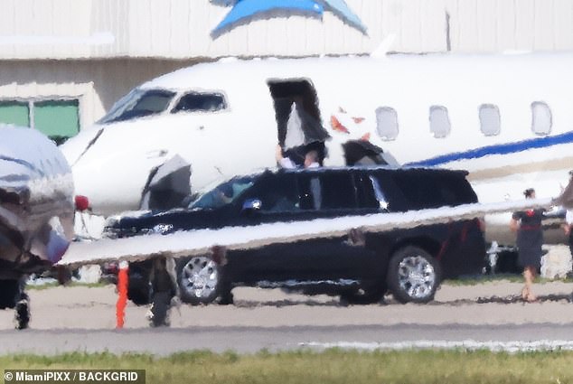 Around 10:30 a.m. Tuesday, a black SUV pulled up to the small plane, several security members got out and took out umbrellas that blocked the pop star boarding the plane.