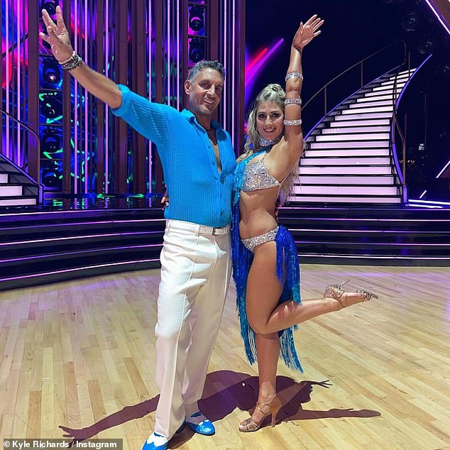 Ready for anything, he posed on the dance floor with his professional partner Emma Slater