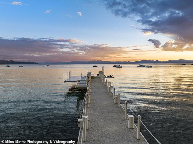 The mansion features a private beach, pier and jet ski platform