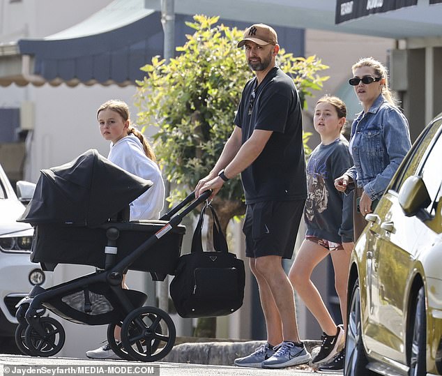 Lyon's girls Milla (left) and Harper (second from right) joined their father and wife Emma to a cafe with their brother in tow