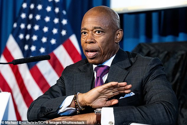 New York Mayor Eric Adams speaks to reporters at the Borough of Manhattan Community College on Thursday