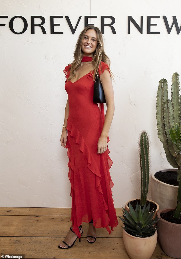 Elsewhere, influencer Ruby Brownless, 29, (pictured) put on a stunning show in a bright red dress with ruffles along the skirts