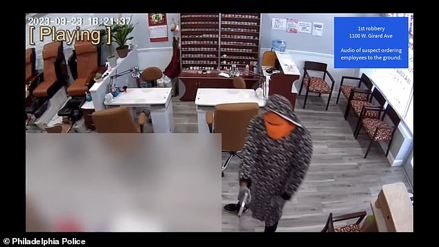 Police footage shows the first man entering the Happy Family Nail Salon and Spa, threatening the employees at gunpoint and telling them to get on the floor