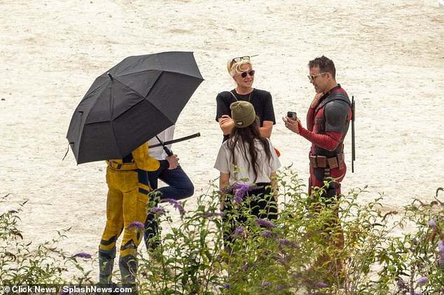 Take a break!  They were joined by the movie's star, Ryan Reynolds, as they took a break between movie scenes (pictured)