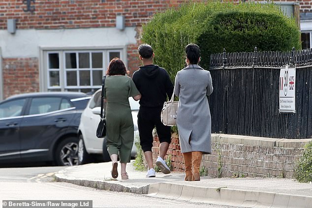 Home time: After their Greek meal in North London, they went out and strolled down the street