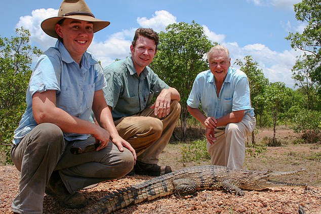 Britton (pictured centre, with his wife Erin on left) once hosted Sir David Attenborough (right).  There is no indication that his wife or Sir David knew of his transgression