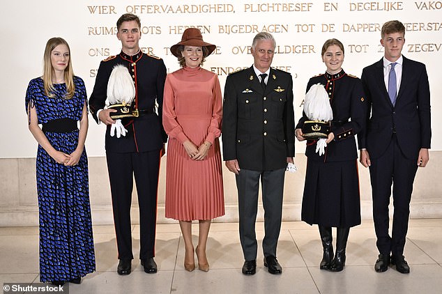 Her mother, Queen Mathilde, chose a soft pink midi dress with a high neckline and a pleated skirt for the occasion