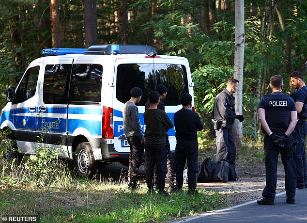 Police detain suspects as they patrol the German-Polish border to prevent illegal migration near Klinge, Germany, September 20, 2023