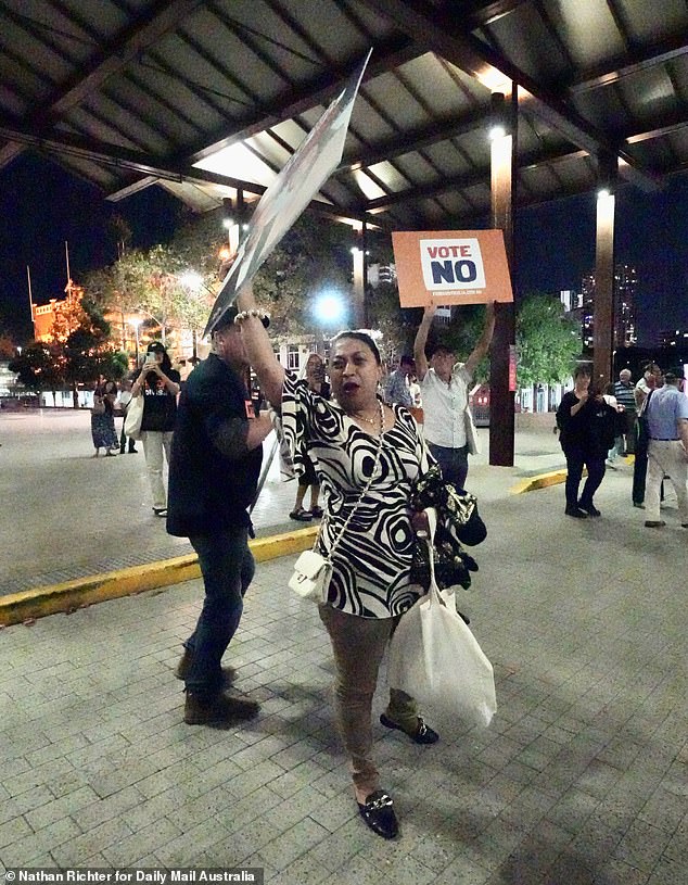 Tensions rose as guests at the No rally held up their own signs and proudly pointed out the merchandise they were wearing — mostly hats and shirts — in return to antagonize the protesters.