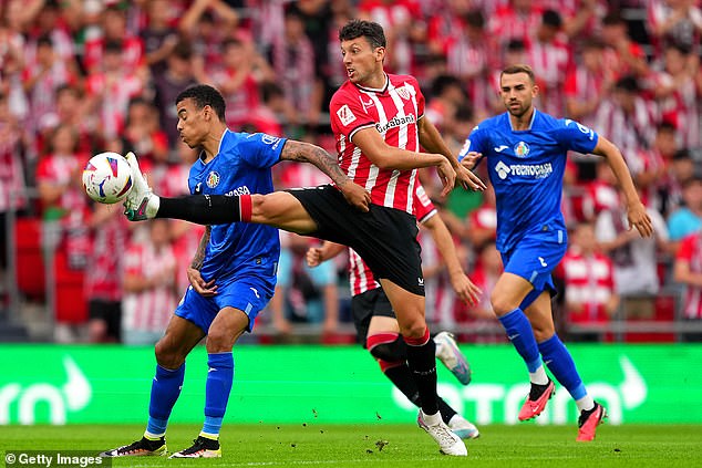 Greenwood (left) was jeered by Athletic supporters during the opening exchange of the match