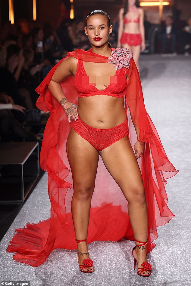 For a unique look, one model wore a red cape as she walked the runway, creating a ruffled effect