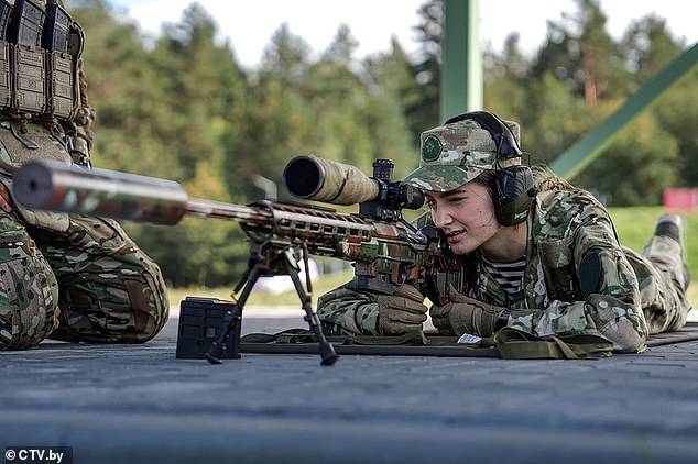 A beauty pageant contestant practices her marksmanship skills