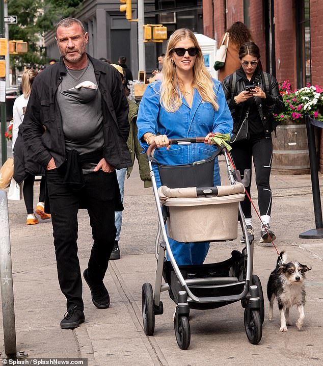 To love;  Liev wore a black jacket, jeans and sneakers for his walk, while Taylor looked chic in denim overalls and white sneakers