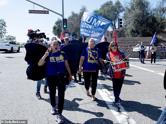 Some of the former president's fans beat drums and sang while waving their flags