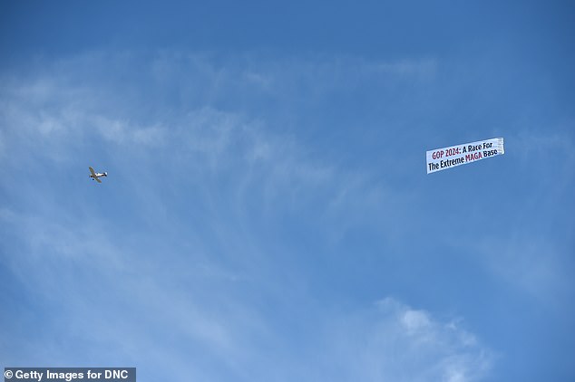 Democrats dominated the debate with a plane circling the library trailing a banner that read: 