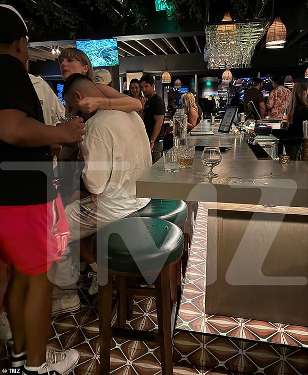 The photo showed Kelce sitting at the bar