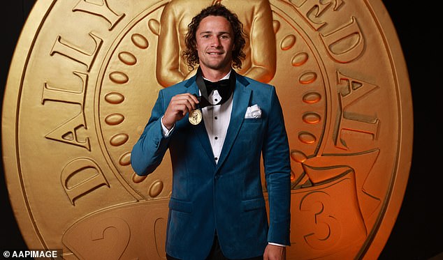 Sharks halfback Nicho Hynes opted for a crisp blue jacket instead of the usual tuxedo (photo, with the Provan-Summons Medal)