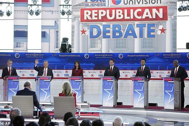 From L-R: North Dakota Governor Doug Burgum, former New Jersey Governor Chris Christie, former UN Ambassador Nikki Haley, Florida Governor Ron DeSantis, entrepreneur Vivek Ramaswamy and Senator Tim Scott stand on their stage during a Republican presidential primary debate hosted by FOX