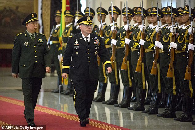 General Li Zuocheng (L) and Milley of the Chinese People's Liberation Army (PLA) review a guard of honor during a welcome ceremony at the Bayi Building in Beijing on August 16, 2016