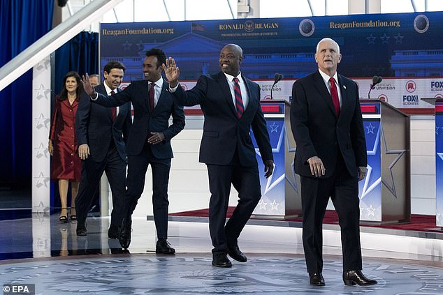 The candidates walk onto the stage at the Reagan Presidential Library on Wednesday evening