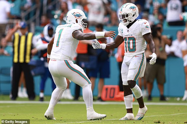 Tua Tagovailoa (left) and Tyreek Hill (right) rioted as the Miami Dolphins defeated the Denver Broncos 70-20 in Week 3