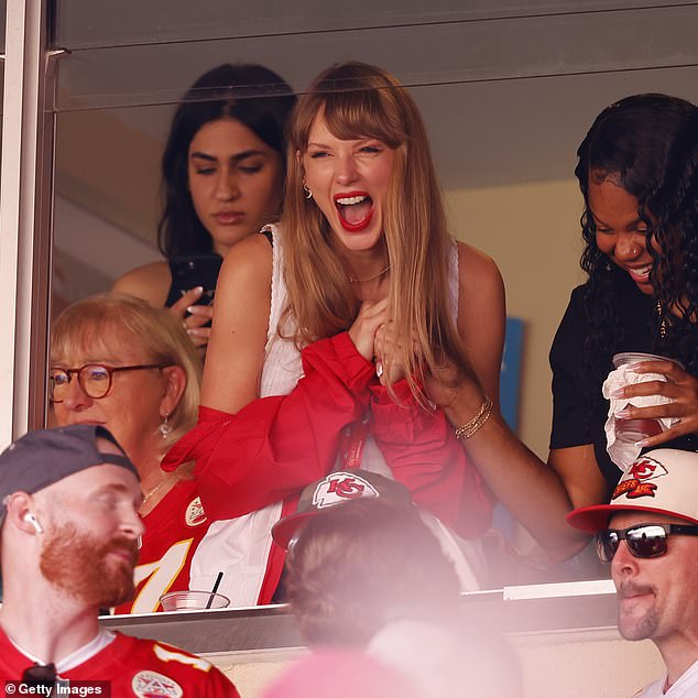 Going public: Taylor indicated her relationship reached a new level when she attended his Kansas City Chiefs game on Sunday when they destroyed the Chicago Bears