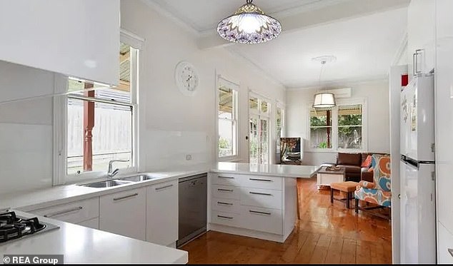 In the photo: The large kitchen is connected to a second living room and features a breakfast island for the whole family and plenty of sofa space