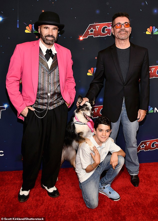 Support: Simon and Eric posed with Adrian Stoica and his dog Hurricane, who were crowned winners of the 18th series of America's Got Talent after Tuesday's live final