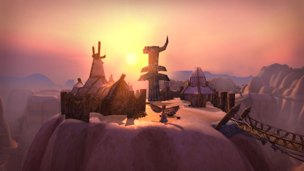 A peaceful sunset over a clifftop settlement in the Thousand Needles region in World of Warcraft Classic