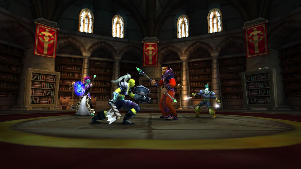 A team of heroes faces off against a mage leader in the Scarlet Monastery dungeon in World of Warcraft Classic.