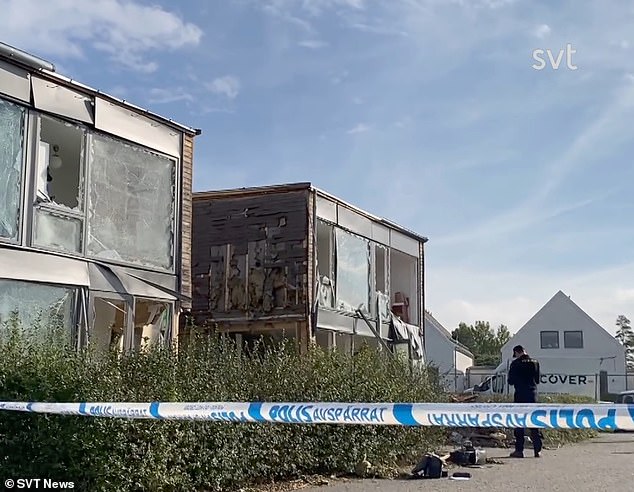 Footage from the bomb's aftermath shows the woman's building torn apart, while smashed windows hang haphazardly from the front of her home in a scene witnesses have likened to a war zone