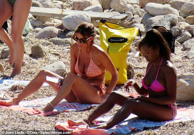 Friendly: Rebecca and Whitney chatted while sitting on beach towels